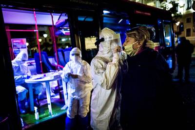 A medic tests a woman in Bratislava. AFP
