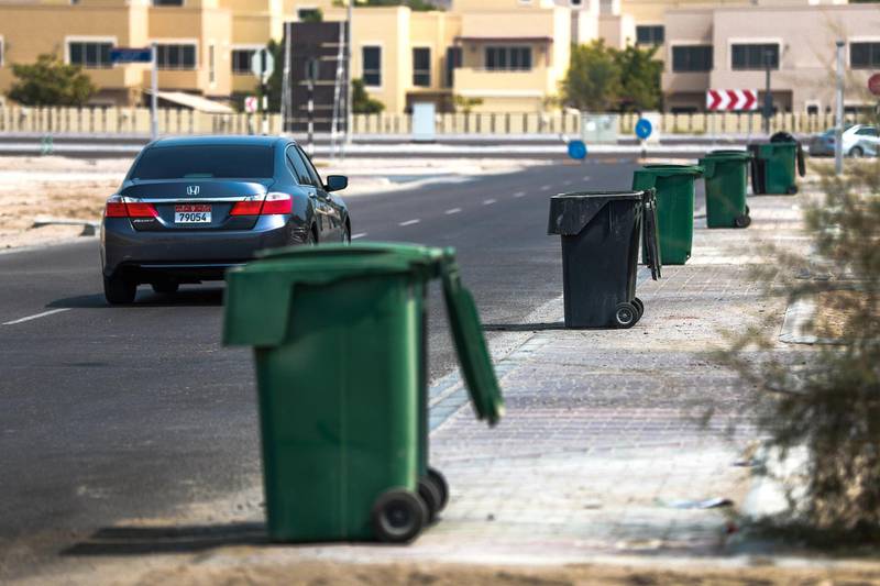 Abu Dhabi, U.A.E., July 22, 2018.  standalone--  Garbage bins waiting for the waste mangement truck on a Sunday morning at Khalifa City.Victor Besa / The NationalSection:  NAReporter: