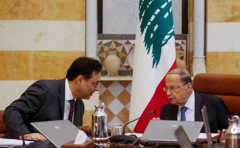 FILE PHOTO: Lebanon's Prime Minister Hassan Diab speaks with Lebanon's President Michel Aoun during a cabinet meeting at the presidential palace in Baabda, Lebanon February 6, 2020. REUTERS/Mohamed Azakir/File Photo