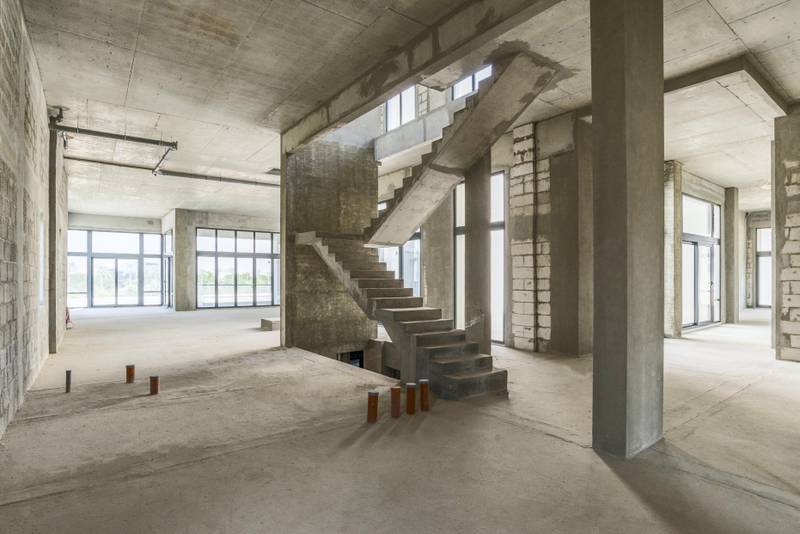The stairs are in, but the banister will be the new owner's choice. Courtesy Luxury Property