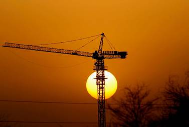 The sun sets over a construction site in Dubai. Stephen Lock / The National . 