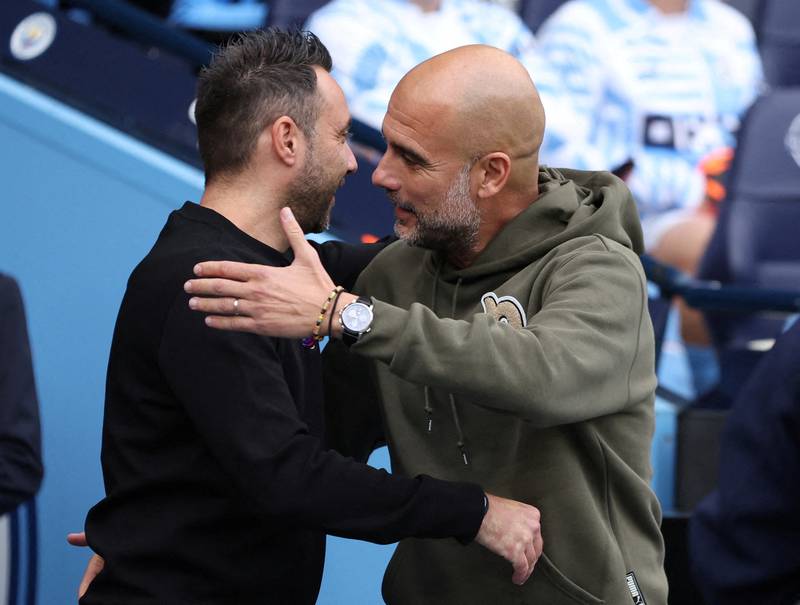 Manchester City manager Pep Guardiola, right, was full of praise for the work of Brighton & Hove Albion manager Roberto De Zerbi, left. Reuters