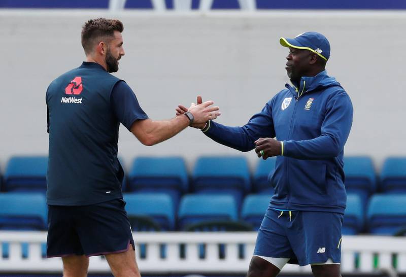 England's Liam Plunkett shakes hands with South Africa head coach Ottis Gibson during nets. Paul Childs / Reuters