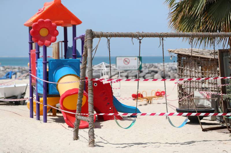 Dubai, United Arab Emirates - Reporter: N/A: A park is closed off on the beach in Jumeriah. Thursday, March 19th, 2020. Jumeriah, Dubai. Chris Whiteoak / The National
