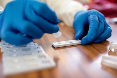 A healthcare worker processes an antigen test for Covid-19 in Kosice, Slovakia. Getty Images