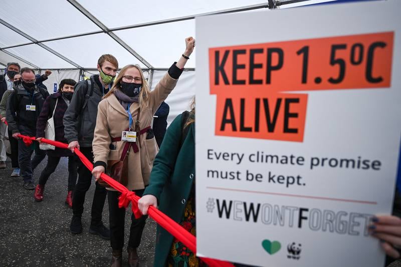 Protesters move through restricted Blue Zone area of Cop26 summit in Glasgow, Scotland. Getty Images