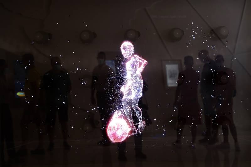 A holographic exhibit in Qatar's pavilion at Expo 2020 Dubai builds anticipation for the upcoming World Cup. Pawan Singh / The National