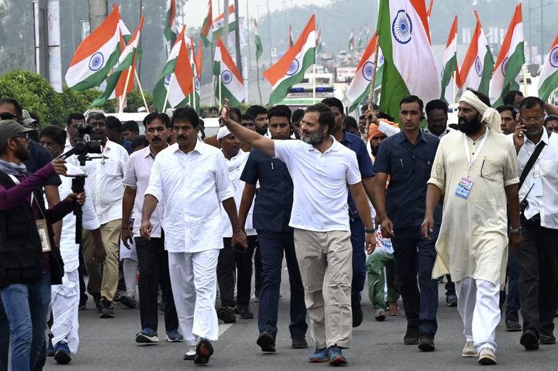 Rahul Gandhi, centre, a leader in India's Congress party, takes part in the Bharat Jodo Yatra, or Unite India March, on the outskirts of Hyderabad on November 1 last year. The march is a five-month, 3,570km trek through 12 states. AFP