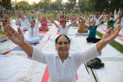 Indian yoga practitioners take part in a yoga session at a park in Amritsar. Narinder Nanu / AFP Photo