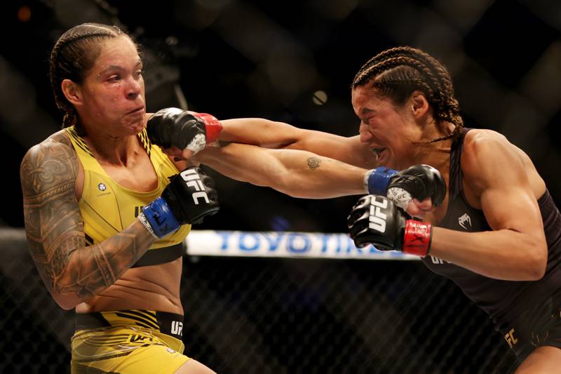 Amanda Nunes and Julianna Pena exchange strikes during their bantamweight title bout at UFC 277. Getty