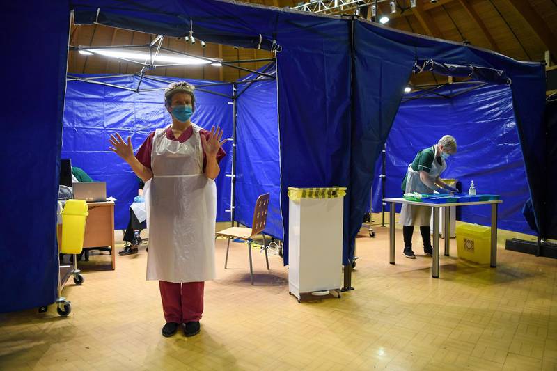 Staff prepare to give Oxford/AstraZeneca vaccinations to patients at a Covid-19 vaccination centre set up inside the Bournemouth International Centre. Getty Images