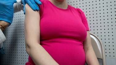 An image that illustrates this article Covid-19 mRNA vaccines safe in pregnancy, study suggests