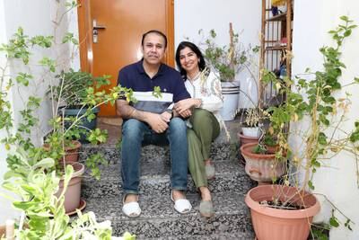 Bhawna Sehra and her husband Gurpreet outside their home, which has a small backyard.