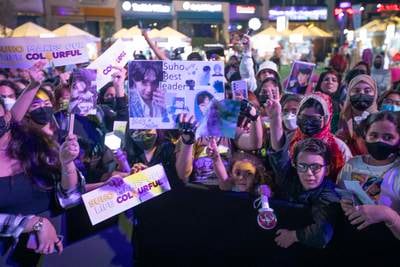 Fans with posters and signs for Suho.