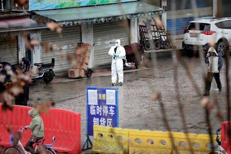 A worker in a protective suit is seen at the closed seafood market in Wuhan, Hubei province, China January 10, 2020. The seafood market is linked to the outbreak of the pneumonia caused by the new strain of coronavirus, but some patients diagnosed with the new coronavirus deny exposure to this market. Picture taken January 10, 2020. REUTERS/Stringer CHINA OUT.     TPX IMAGES OF THE DAY