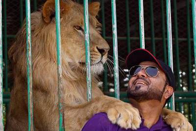 Ras Al Khaimah, United Arab Emirates- March, 15, 2012;   Jasim Al Azur  pose next to the Lion at his  private zoo  in Ras Al khaimah .  (  Satish Kumar / The National ) Story by Awad