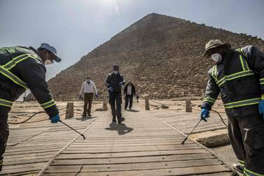Egyptian municipality workers disinfect the Giza pyramids necropolis on the southwestern outskirts of the Egyptian capital Cairo, as a protective measure against the spread of the coronavirus. AFP