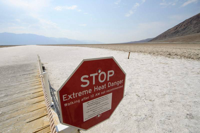 Sign warns of extreme heat at the Badwater Basin salt flats inside Death Valley National Park in California. AFP
