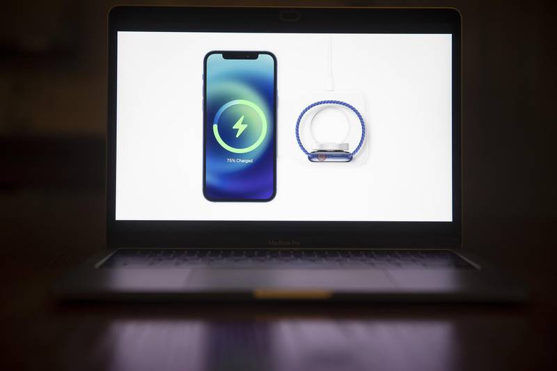 MagSafe wireless charging for the Apple iPhone 12 is unveiled during a virtual product launch seen on a laptop computer in Tiskilwa, Illinois, U.S..  Bloomberg