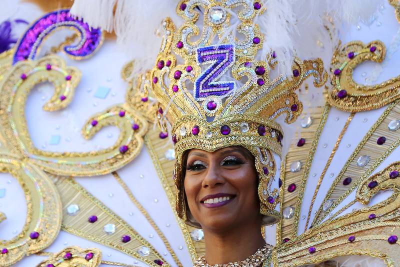 Crystal Guillemet, Queen of Zulu, smiles as she parades down St Charles Avenue during Mardi Gras. Reuters