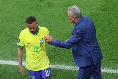Brazil coach Tite greets Neymar as he is replaced. AFP