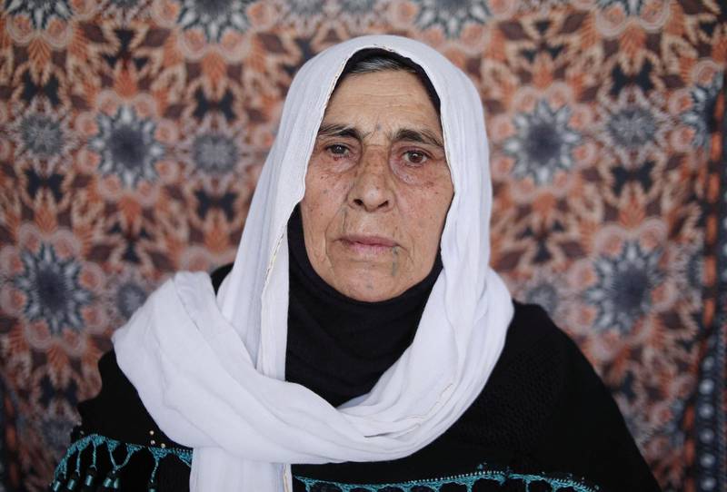 Fatima Abdulkadir, 71, one of the victims of the Halabja Chemical attack in 1988, poses for a picture in the Kurdish town, 300 kms (190 miles) northeast of Baghdad. AFP