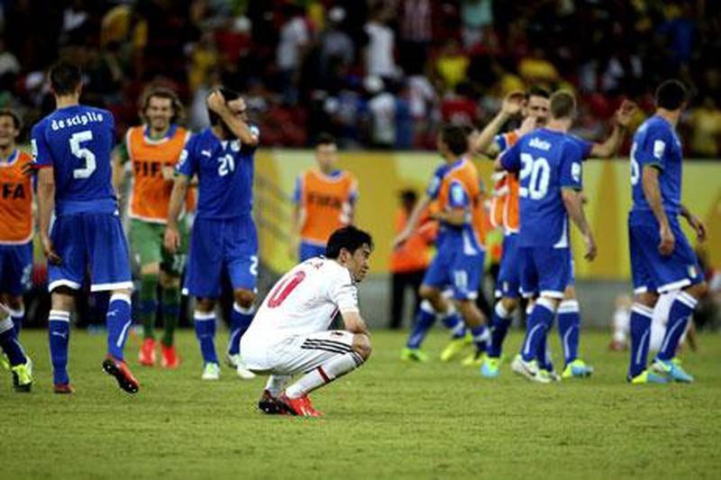 It was a heartbreaking outcome for Shinji Kagawa's Japan after their defeat to Italy. Sebastiao Moreira / EPA