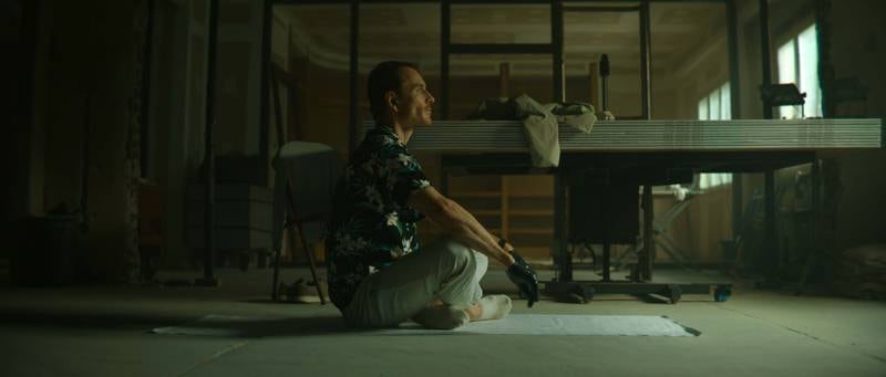 Michael Fassbender's assassin character practicing yoga in the opening of The Killer. Photo: Netflix