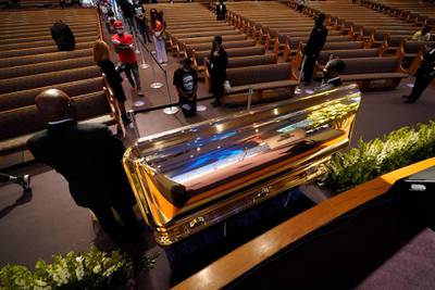 Mourners pass by the casket of George Floyd during a memorial for Floyd at the Fountain of Praise church, in Houston, Texas. EPA