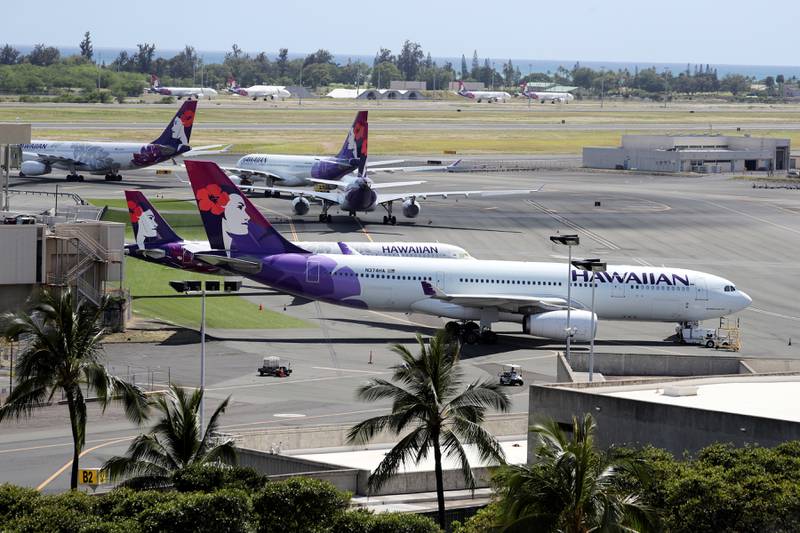 Hawaiian Airlines planes sit idle on the runway at the Daniel K Inouye International Airport in Honolulu, Hawaii. Reuters