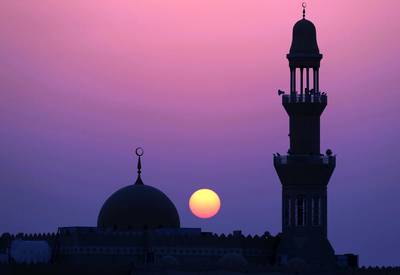 Abu Dhabi, United Arab Emirates - May 31st, 2018: Standalone. The sun sets over a mosque during Ramadan. Thursday, May 31st, 2018 at Al Bahya, Abu Dhabi. Chris Whiteoak / The National