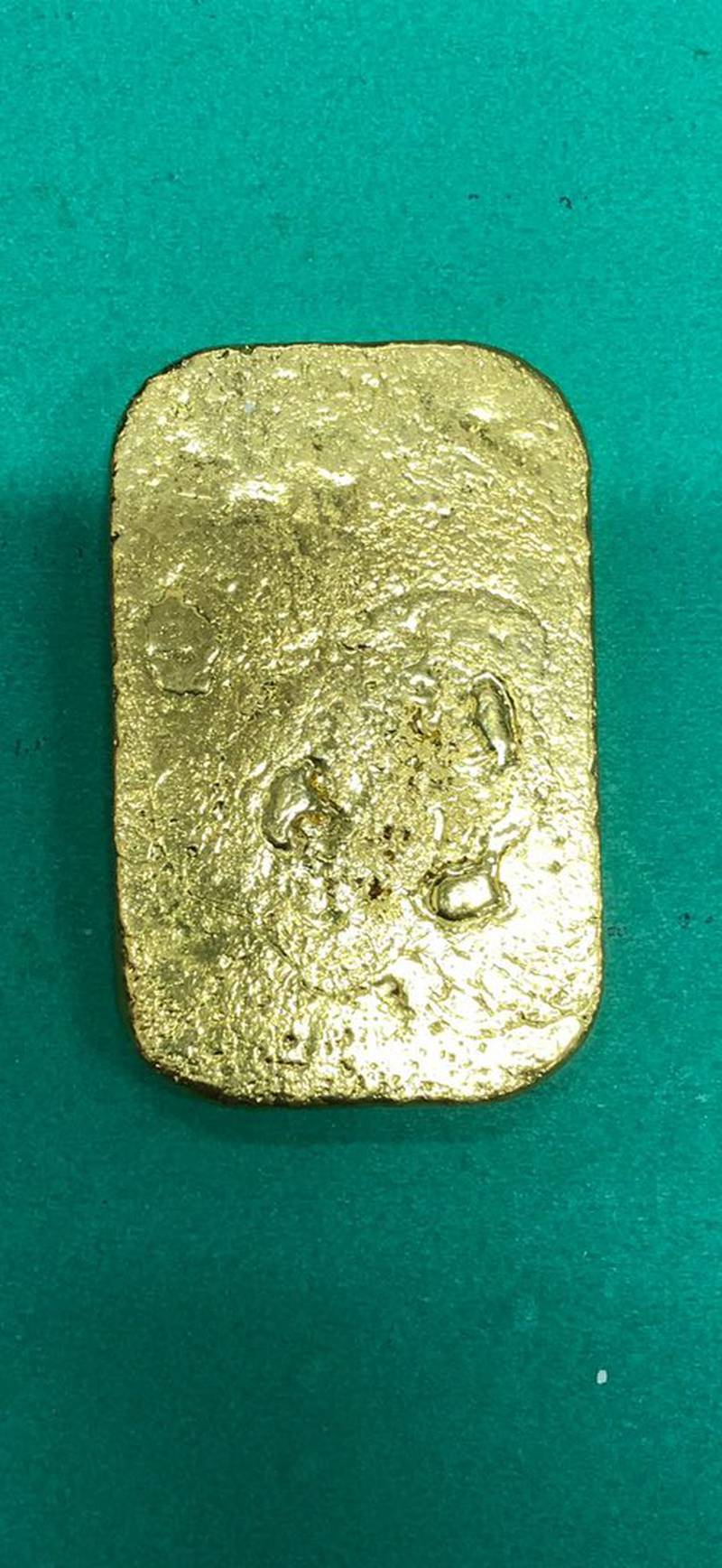 Delhi Customs said a passenger who came off a flight from Dubai was found to have melted down this 443 gram bar of gold into a paste and wrapped it around his legs. Photo: Delhi Customs