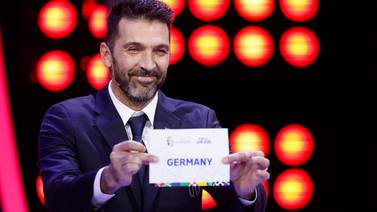 Former Italy goalkeeper Gianluigi Buffon pulls out Germany during the final draw for the UEFA Euro 2024 European Championship. AFP