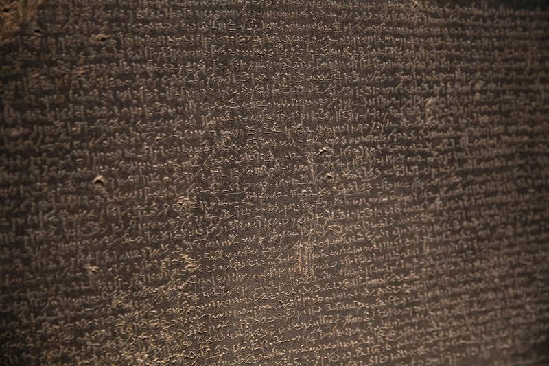 LONDON, ENGLAND - NOVEMBER 22: The Rosetta Stone is displayed at The British Museum on November 22, 2018 in London, England. The Rosetta Stone is one of the museum's most important pieces playing a vital role in historians understanding hieroglyphics for the first time as they sit alongside Demotic and Ancient Greek scripts.  (Photo by Dan Kitwood/Getty Images)
