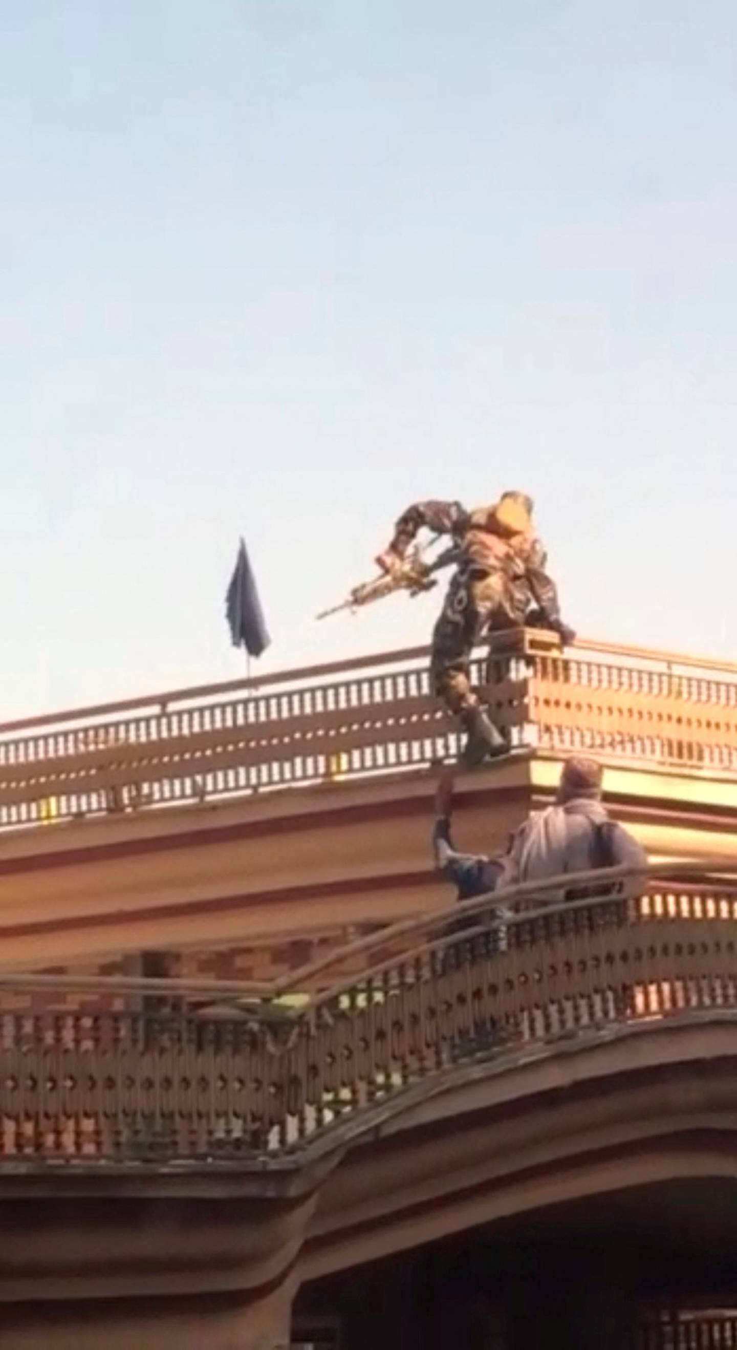 An image taken from footage on social media  shows Taliban Special Forces climbing a nearby building in Kabul. via Reuters