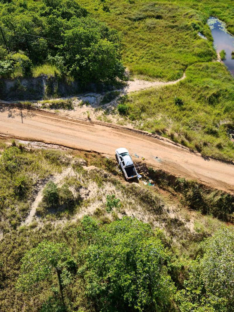 A car involved in an ambush on a convoy of vehicles carrying civilians who had been sheltering in a hotel in Palma, lies wrecked on the side of the road, in Mozambique, in this picture taken between March 24 and March 27, 2021 and obtained by Reuters on March 30, 2021. Dyck Advisory Group/Handout via REUTERS THIS IMAGE HAS BEEN SUPPLIED BY A THIRD PARTY. MANDATORY CREDIT.