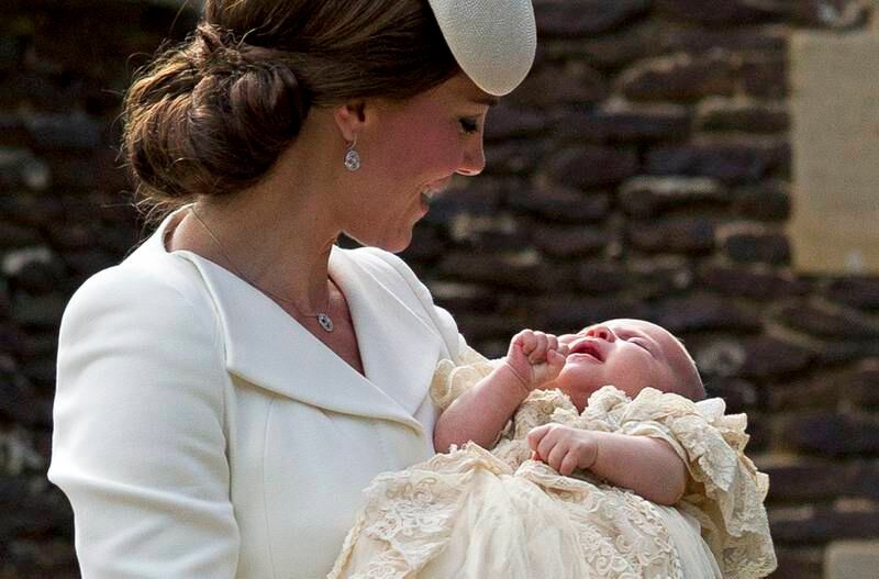 Catherine with her daughter Princess Charlotte at the Church of St Mary Magdalene on the Sandringham Estate for the princess's christening in July 2015. 