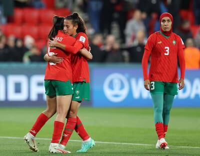 Nesryne El Chad, left, and Sarah Kassi embrace after losing to France in the Women's World Cup with Nouhaila Benzina in the background. Sarah Reed / Getty Images