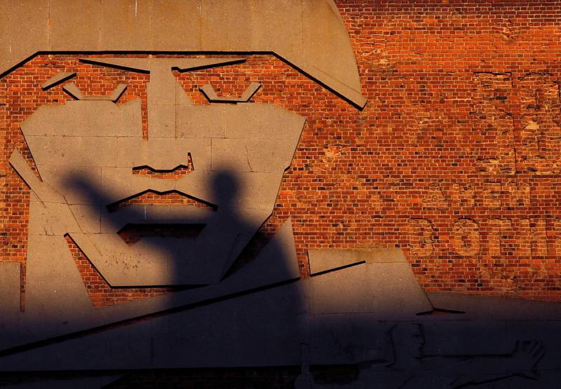 A statue of Soviet state founder Vladimir Lenin casts a shadow on a bas-relief in Volgograd, Russia. Toru Hanai / Reuters