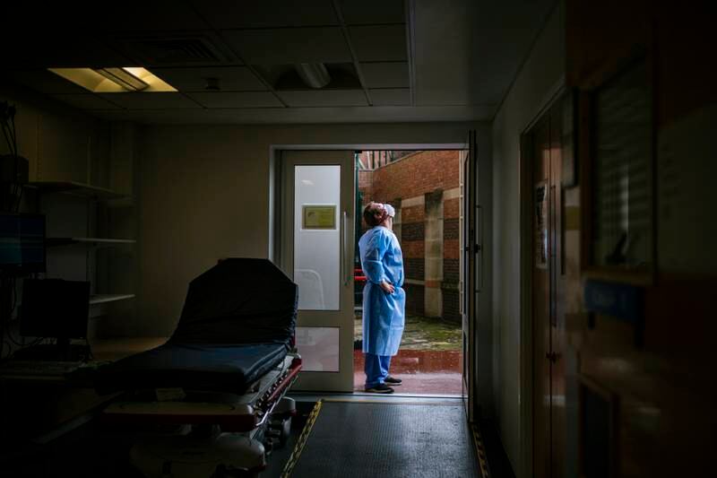 A tired NHS worker takes a breather outside the paramedics' entrance at Blackpool Victoria Hospital, as pressure on the health service grows. Getty Images