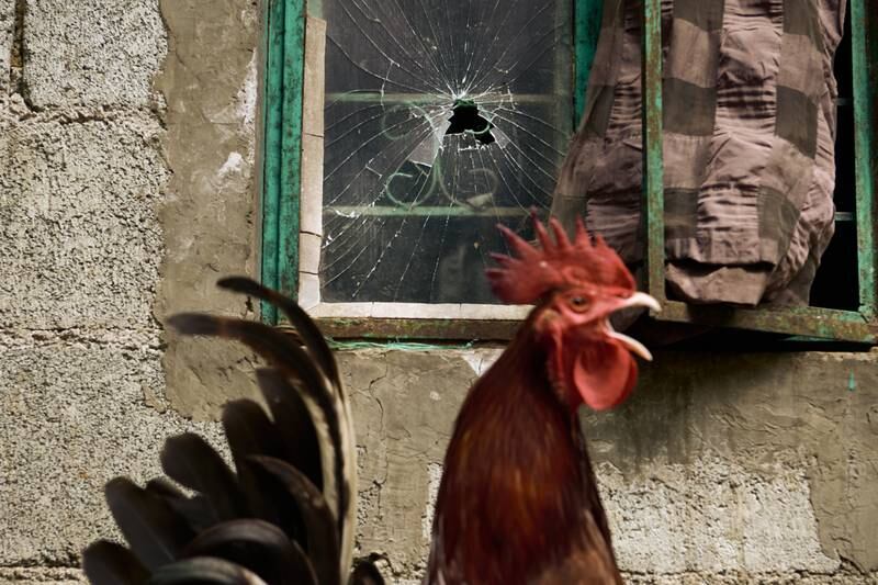 A bullet hole in a window after a shooting that killed two in Rizal, Luzon. Getty Images
