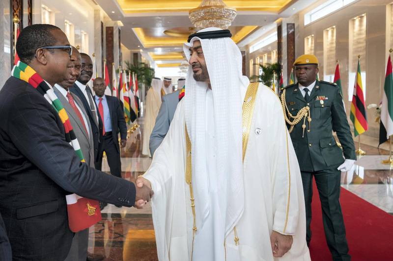 ABU DHABI, UNITED ARAB EMIRATES - March 16, 2019: HH Sheikh Mohamed bin Zayed Al Nahyan, Crown Prince of Abu Dhabi and Deputy Supreme Commander of the UAE Armed Forces (R), greets a member of the delegation accompanying HE Emmerson Mnangagwa, President of Zimbabwe (not shown), during a reception at the Presidential Airport. 

( Ryan Carter for the Ministry of Presidential Affairs )
---