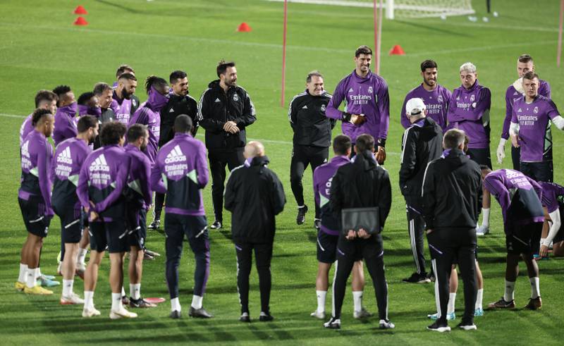 Real Madrid coach Carlo Ancelotti talks with his players during training. Reuters