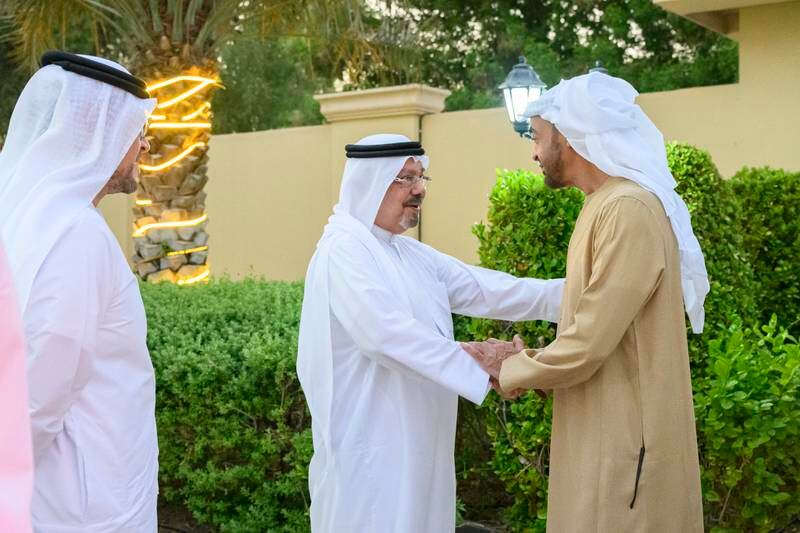 President Sheikh Mohamed departs after a visit to the home of Ali Mohammed Al Shorafa Al Hammadi. Seen with Mohammed Ali Al Shorafa Al Hammadi, left, chairman of the Abu Dhabi Department of Economic Development.