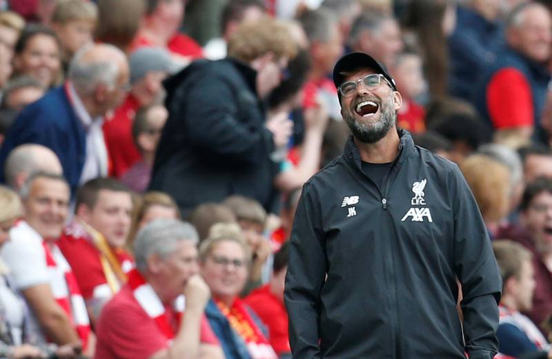 Liverpool manager Juergen Klopp laughs on the sidelines. Reuters