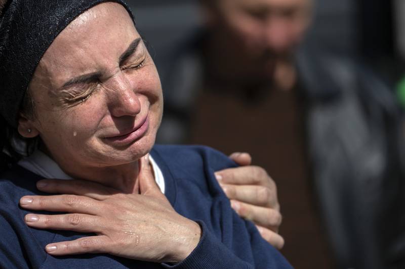Oksana Kolesnikova cries during the funeral of her son Anatoliy Kolesnikov, 30, a territorial defense soldier who was killed by Russian soldiers in Irpin, in the outskirts of Kyiv, Ukraine. AP Photo