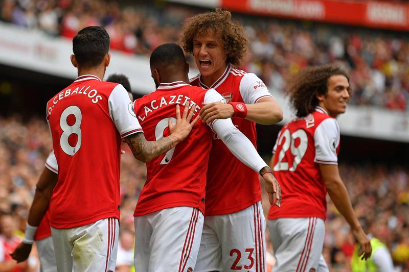 Arsenal's David Luiz congratulates Arsenal's French striker Alexandre Lacazette on scoring the opening goal. AFP