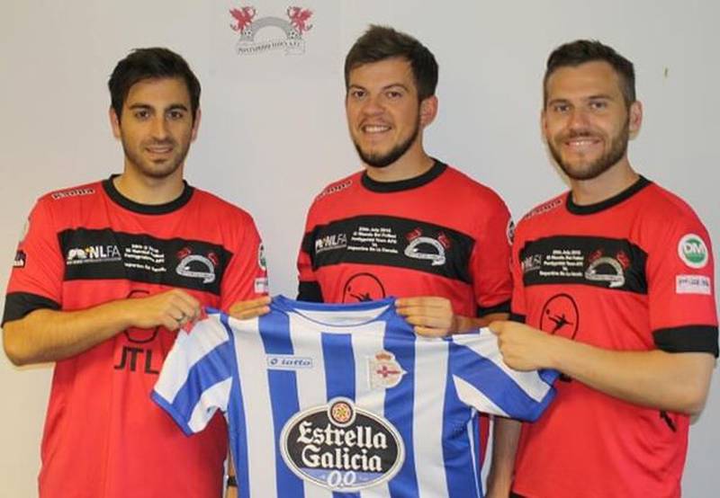 Pontypridd Town players hold a Deportivo La Coruna shirt after their friendlty match. Photo: Pontypridd Town