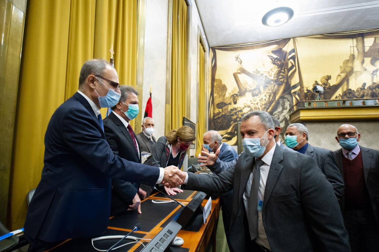 This handout photograph released on October 23, 2020 by the United Nations Office in Geneva shows representative of Libya's two rival factions shaking hands after a signing ceremony, on October 23, 2020. Libya's two rival factions signed a "permanent" ceasefire agreement after five days of talks at the United Nations, which hailed the deal as a historic moment after years of turmoil and bloodshed. "Today is a good day for the Libyan people," said Stephanie Williams, the UN's acting envoy to the troubled North African country, where a UN-recognised government in Tripoli has been battling a rival administration based in the east and dominated by military commander Khalifa Haftar. - RESTRICTED TO EDITORIAL USE - MANDATORY CREDIT "AFP PHOTO / UNITED NATIONS / VIOLAINE MARTIN" - NO MARKETING NO ADVERTISING CAMPAIGNS - DISTRIBUTED AS A SERVICE TO CLIENTS


 / AFP / UNITED NATIONS / UNITED NATIONS / Violaine MARTIN / RESTRICTED TO EDITORIAL USE - MANDATORY CREDIT "AFP PHOTO / UNITED NATIONS / VIOLAINE MARTIN" - NO MARKETING NO ADVERTISING CAMPAIGNS - DISTRIBUTED AS A SERVICE TO CLIENTS


