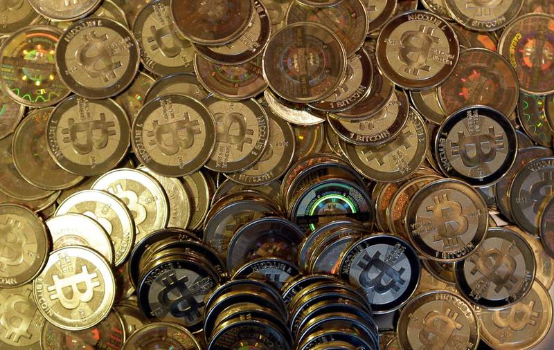 FILE - This April 3, 2013, file photo shows bitcoin tokens in Sandy, Utah. Unidentified hackers broke into the Twitter accounts of technology moguls, politicians, celebrities and major companies Wednesday, July 15, 2020, in an apparent Bitcoin scam. (AP Photo/Rick Bowmer, File)